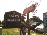 The Native Seafood crew poses under Sherman the Shrimp.